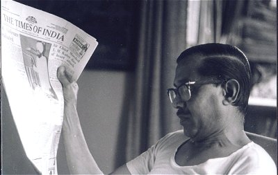 Indian Man Reads Newspaper