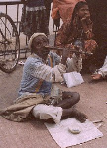 A blind street beggar