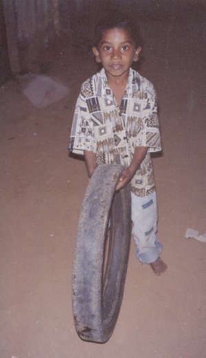 Boy Playing with a Wheel