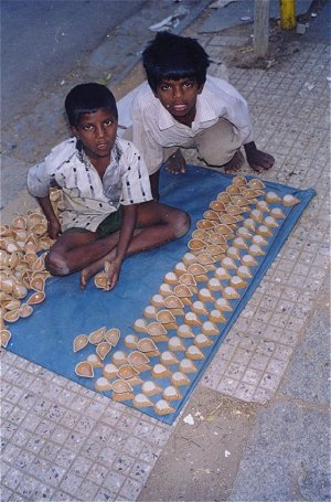 Boys Selling Diwali Diyas 