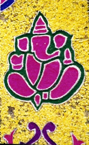 Lord Ganesh in a Floral Rangoli