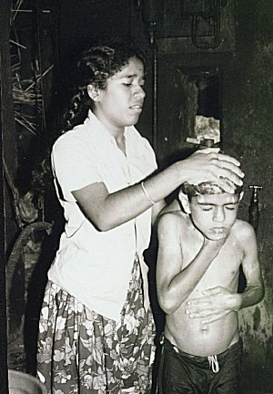 A sister giving bath to her brother