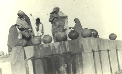 Women Chatting Near a Well