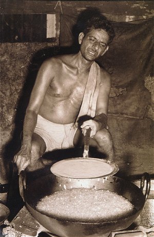 A Bare Chested Cook at Work