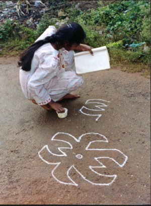 Girl Learning Rangoli