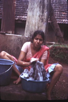 Woman Handwashing Clothes 