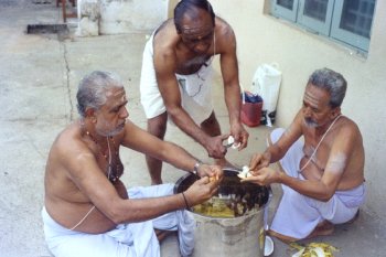 Priests Lending a Hand