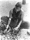 A Halakki Gowdati (lady of the Halakki community) peeling areca nut (supari)
