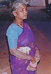 Woman fixing herself a Chewing Paan