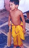 Iyengari Boy Playing Cricket