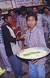 Boy Distributing Temple Food