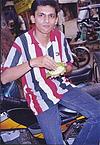 Devotee Partaking <i>Prasadam</i> (temple food)
