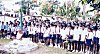 Unifromed Boys Hoisting National Flag