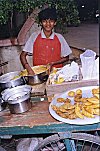 Boy Making and Vending Streetside Snacks