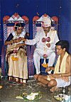 Priest Administering Rituals While the Couple Wait