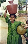 Girl Fetching Water for Household Use