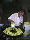 Man Laying Jilebis at a Village Fair