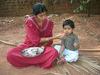 Mother Hand-feeding a Child