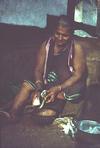 Old Woman Peeling Vegetables