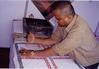 Man Making Hand-prints on Fabric