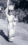 Woman Balancing Basket and Child