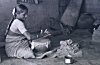 Potter-woman processing mud for pot-making