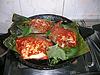 Pomfret Fish being Fried on a Stone Pan