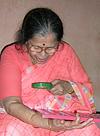 Jyotsna Appreciating an Ancient Coin