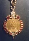 Pendant Featuring a Meditating Saint