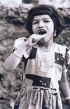 Girl Brushing her Teeth