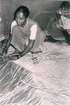 Woman Weaving a Carpet