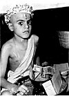 A Brahmin Vatu (student)  begs his first meal -- <I>Upanayanam </I>