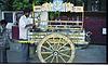 colorful cart with soda vendor