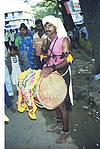 A drummer with drum in procession