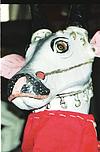 Mask of cow in street procession