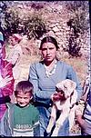 A nepali women with ram in her arms with kid