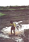 Son of the Soil -- Boy playing in dirt