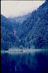 A lake side view beside a mountain