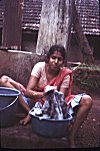 Woman Handwashing Clothes