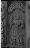 A deity a heavily ornamented male figure