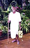 Villager Selling Bananas and Banana Leaves