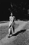 A woman hurrying to puja place