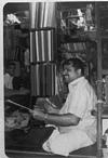 cloth merchant Tulasidas kamat in his shop