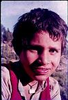 A trible boy with talisman in neck