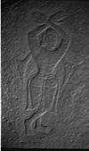 An incomplete carving of a devotee in stone
