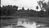 A temple gopuram in a distance