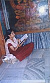 Girl Studying in a Corner of a Temple