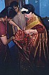 Girl Gets Help Putting on a Saree