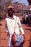 Villager playing Dole at fair, Folk artist