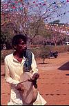 Villager playing Tamate at fair, Folk artist